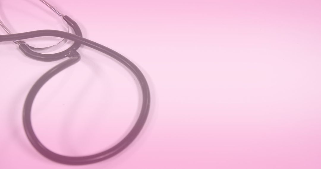 Stethoscope on Pink Background with Hearts Overlay