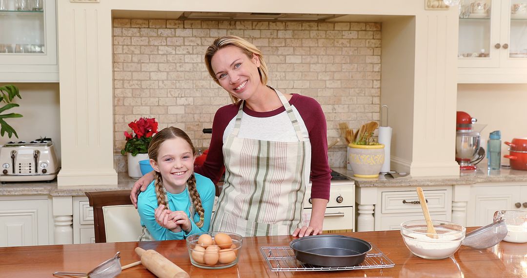 Mother and Daughter Smiling in Kitchen Preparing Dough - Free Images, Stock Photos and Pictures on Pikwizard.com