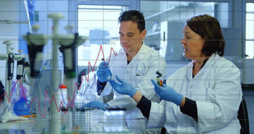 Mentor-Mentee Scientists Analyzing Data in Research Laboratory