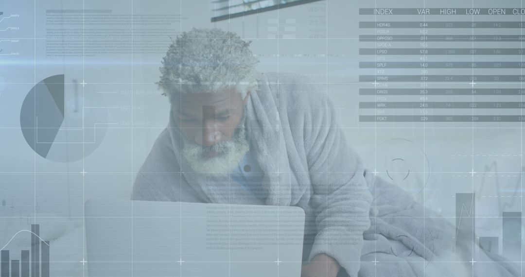 Senior African American Man Analyzing Data on Laptop at Home