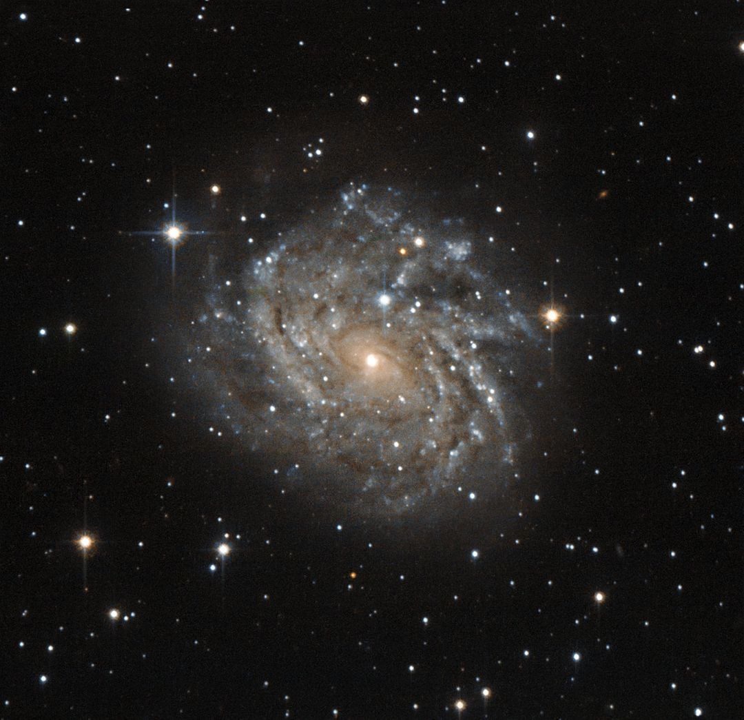 Hubble peeks at a spiral galaxy - Free Images, Stock Photos and Pictures on Pikwizard.com