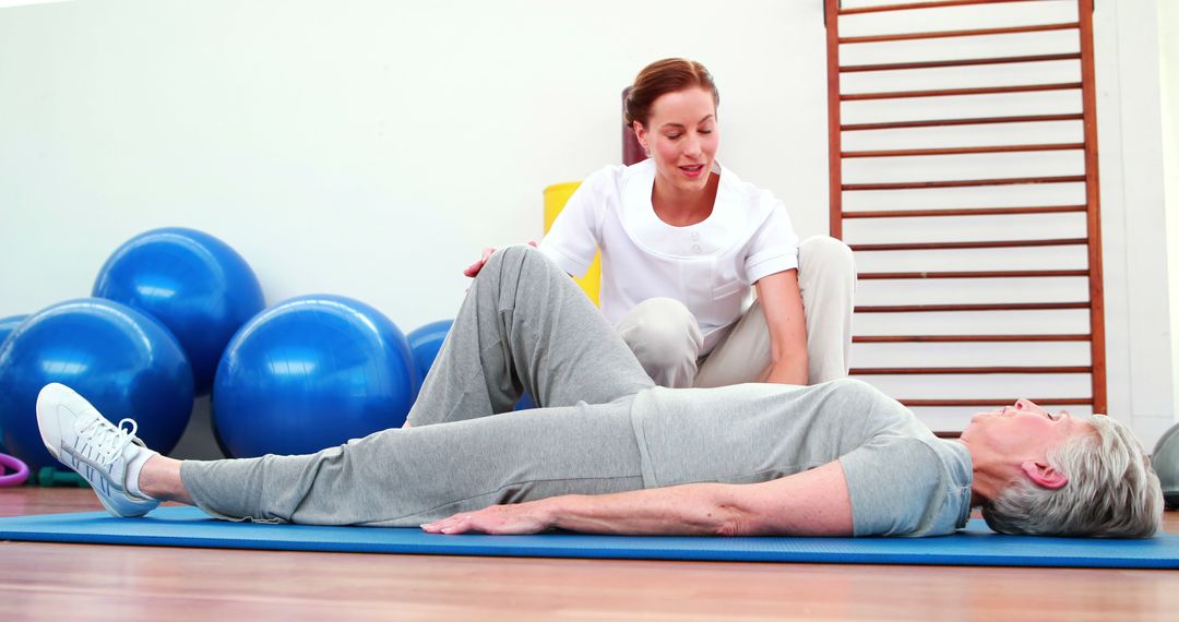 Physical Therapist Assisting Senior Woman during Rehabilitation Exercises - Free Images, Stock Photos and Pictures on Pikwizard.com