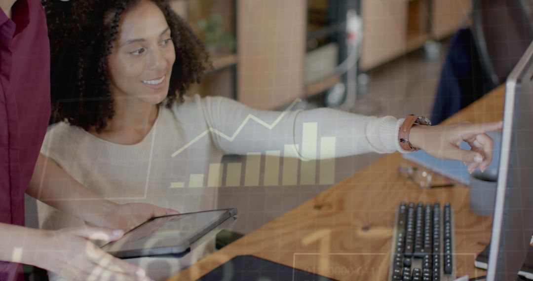 Diverse Team Analyzing Financial Data Charts in Modern Office