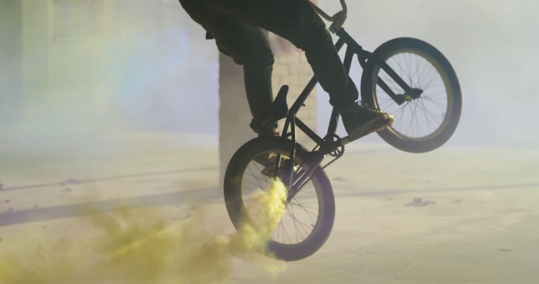 BMX Rider Performing Tricks with Colorful Smoke Effects - Free Images, Stock Photos and Pictures on Pikwizard.com