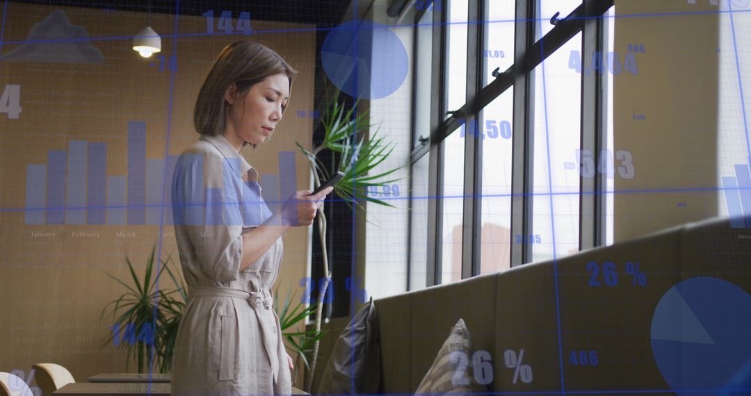 Businesswoman Analyzing Data on Smartphone with Growing Graphs
