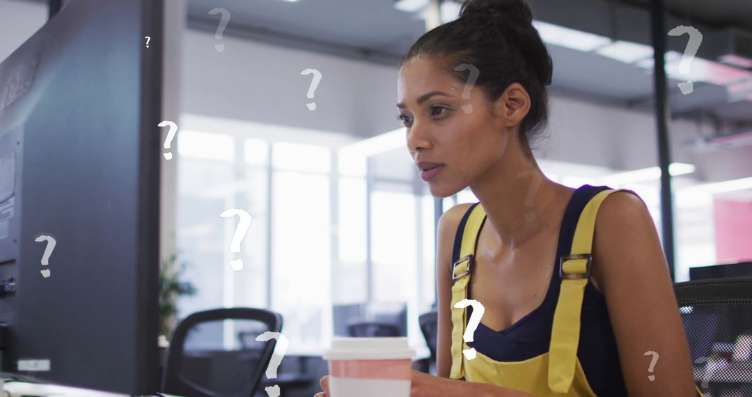 Confused Woman in Office Working on Computer with Question Marks