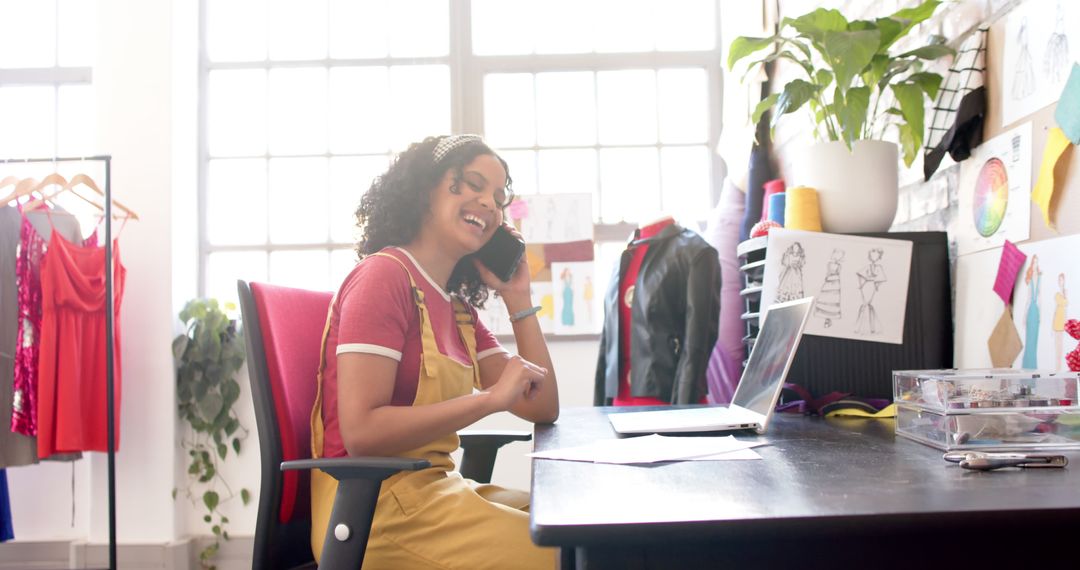 Creative Fashion Designer in Studio Working on Laptop and Phone