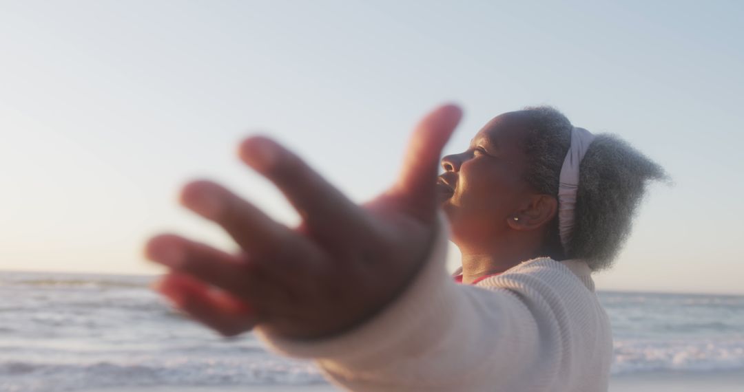 Senior Woman Enjoying Coastal Sunrise - Free Images, Stock Photos and Pictures on Pikwizard.com