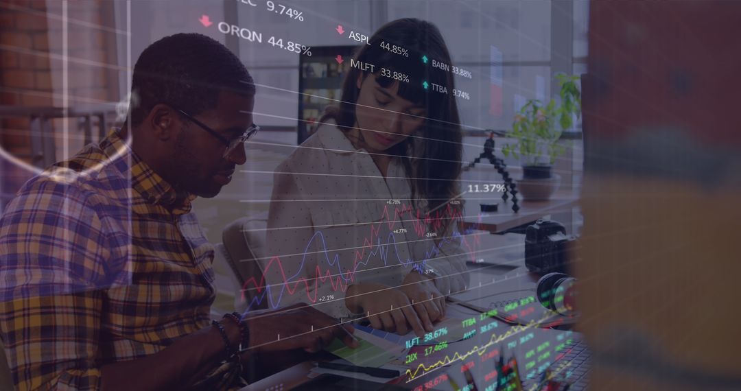 Diverse Colleagues Analyzing Financial Data in Modern Office