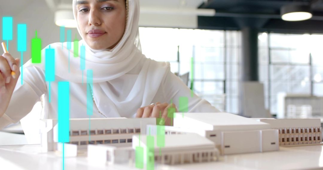 Modern Architect in Hijab Analyzing Data and Models