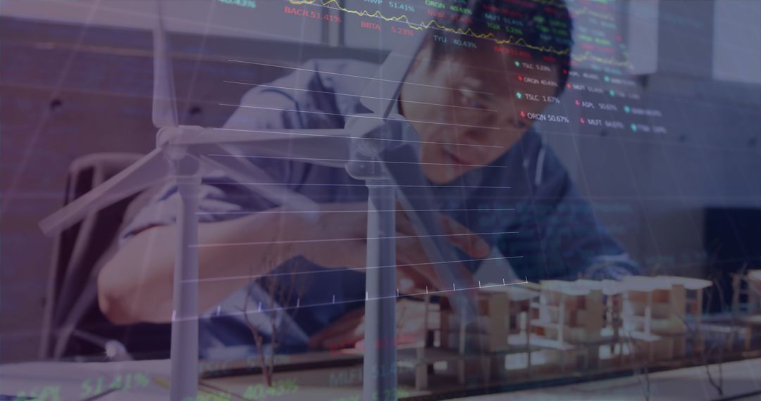 Engineer Working on Model with Stock Market Data Overlay
