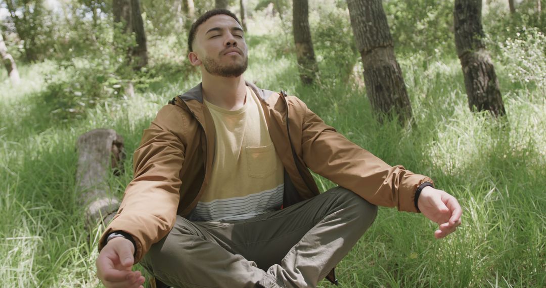 Young Man Meditating Outdoors in Woodland - Free Images, Stock Photos and Pictures on Pikwizard.com