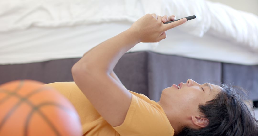 College Student Relaxing While Using Smartphone