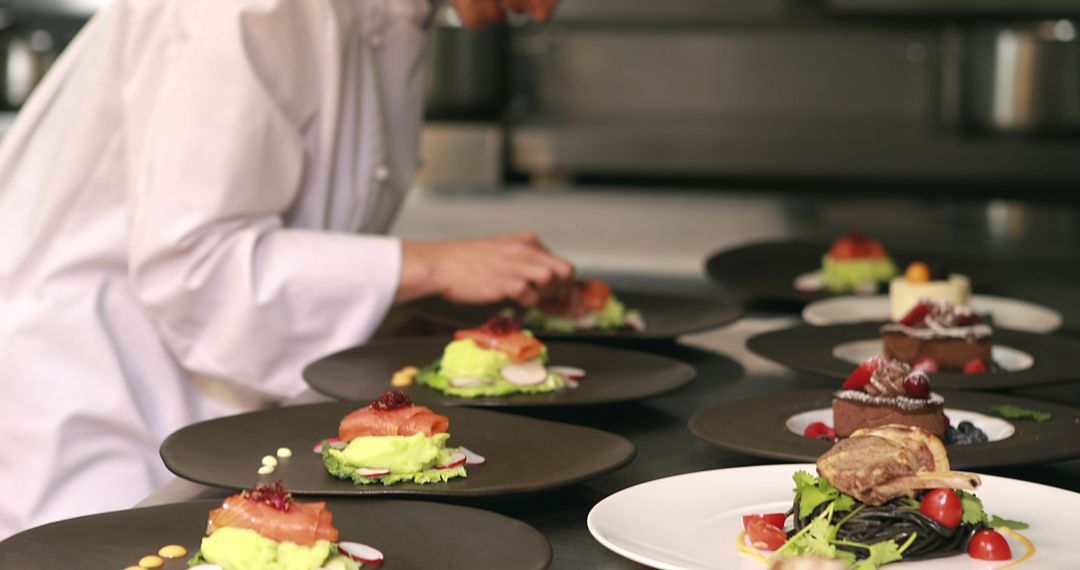 Chef Plating Gourmet Dishes in Professional Kitchen - Free Images, Stock Photos and Pictures on Pikwizard.com