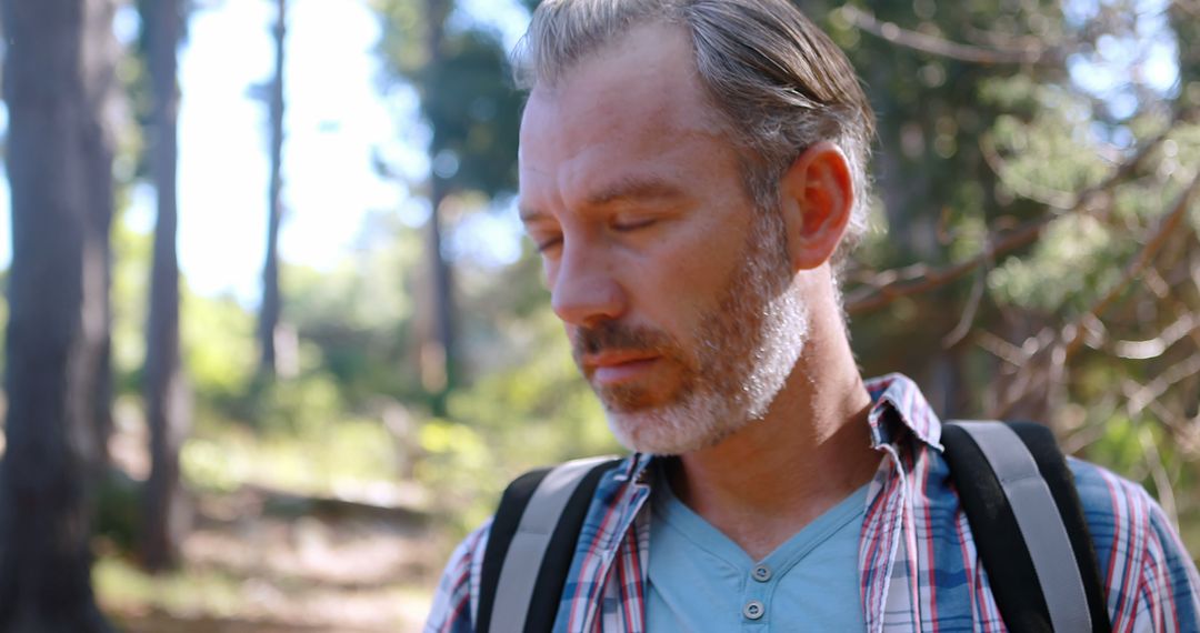 Tired Hiker Resting in Serene Forest Landscape