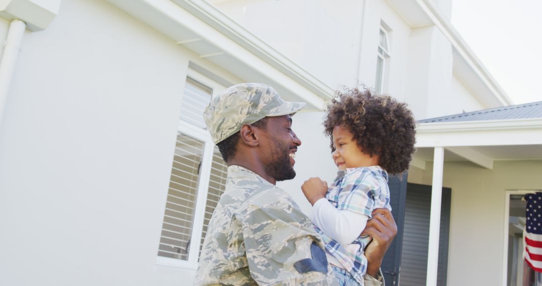 Image of biracial son welcoming african american soldier father - Free Images, Stock Photos and Pictures on Pikwizard.com