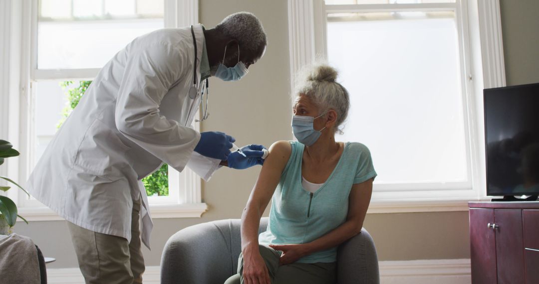 Elderly Woman Receiving Vaccine from Doctor in Home - Free Images, Stock Photos and Pictures on Pikwizard.com