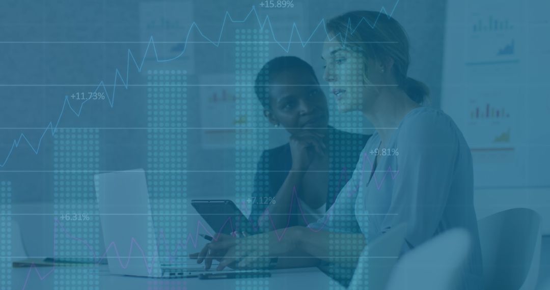 Diverse Businesswomen Analyzing Financial Data and Planning Strategy