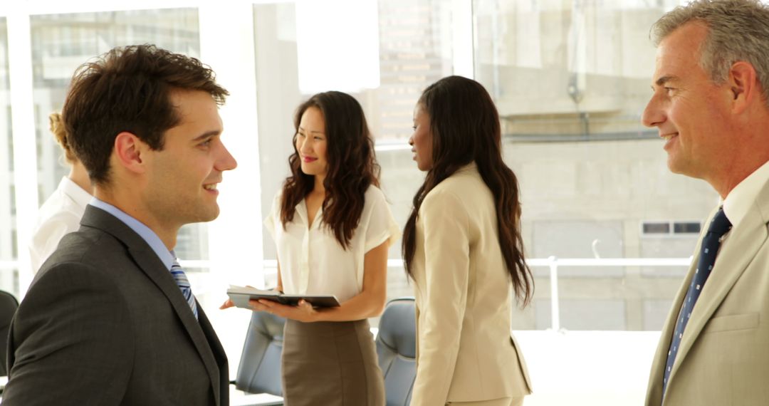Business Professionals Engaging in Office Conversation