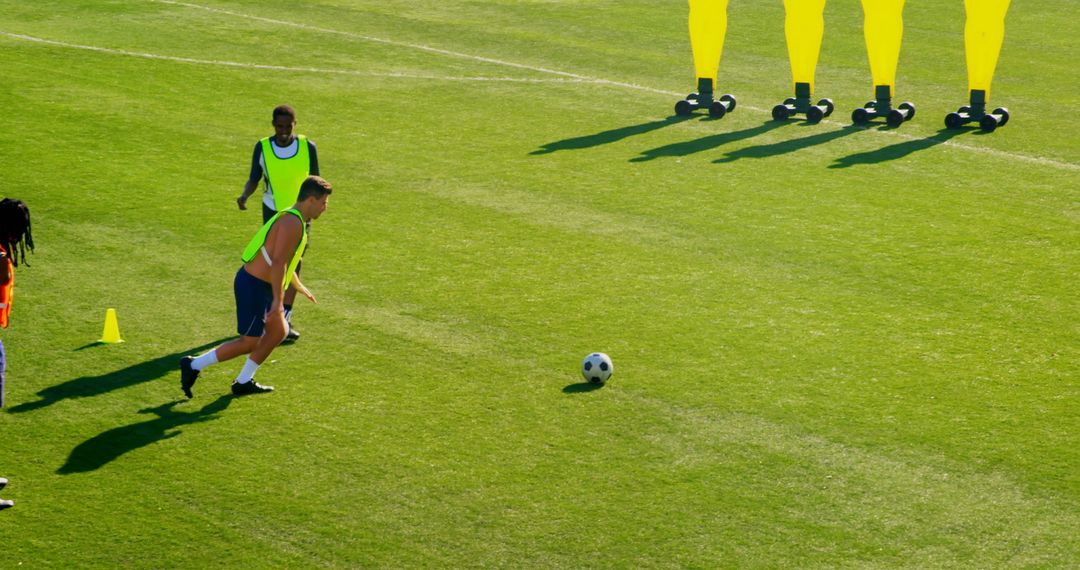 Young Men Focused on Soccer Skill Training in Sunny Field - Free Images, Stock Photos and Pictures on Pikwizard.com