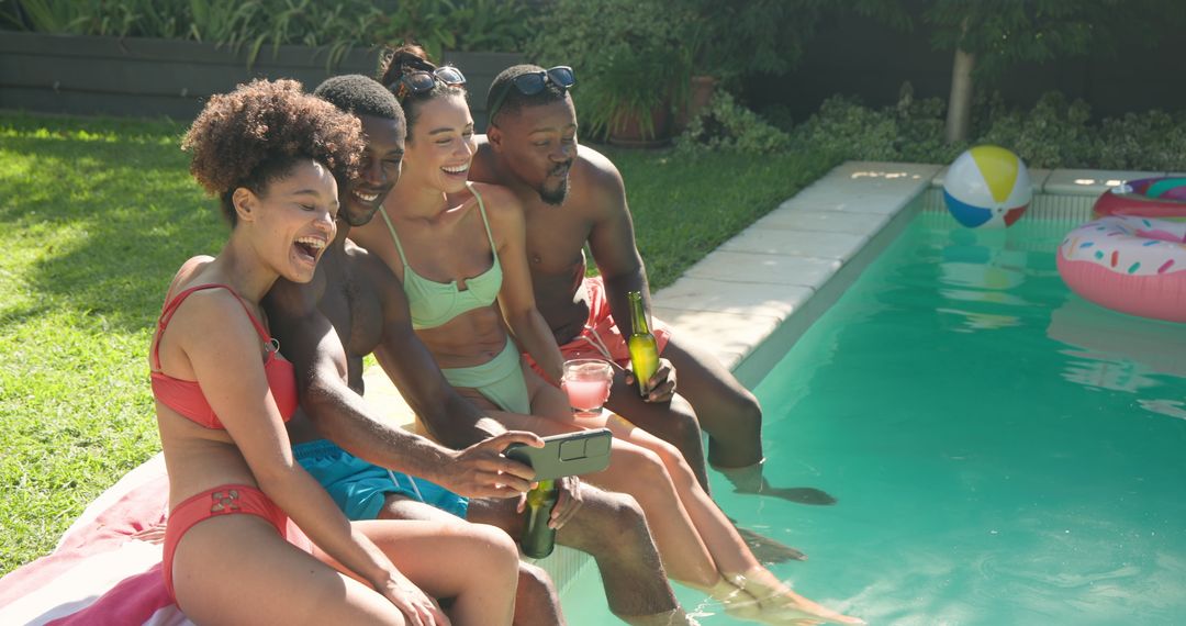 Diverse Friends Socializing Poolside with Drinks and Smartphone