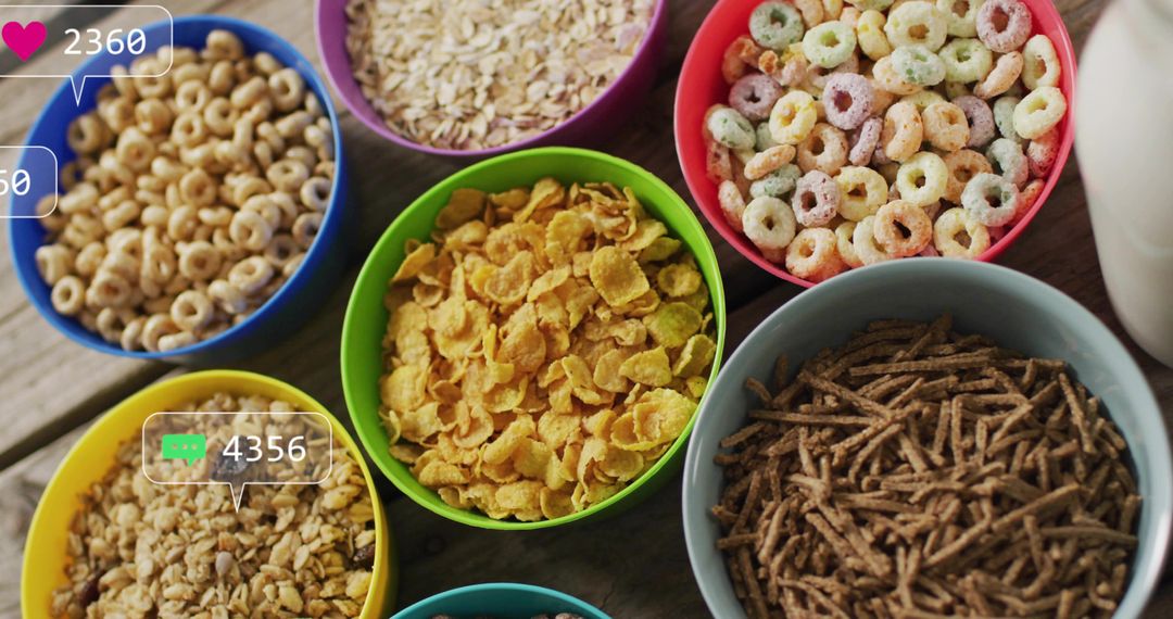 Colorful cereal bowls featuring variety of grains, flakes and loops on rustic wooden table