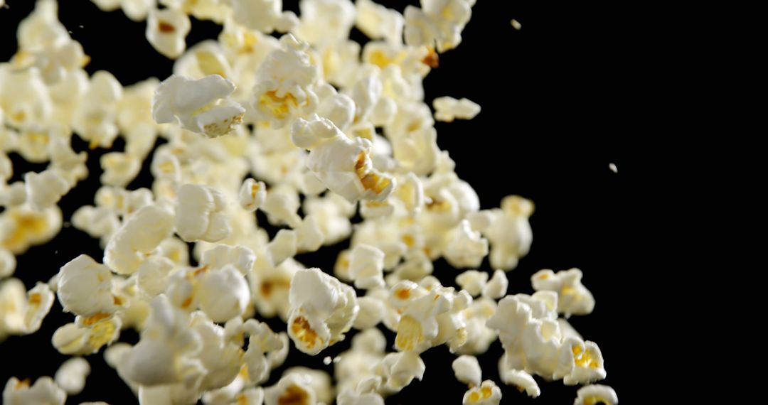 Flying Popcorn Against Black Background - Free Images, Stock Photos and Pictures on Pikwizard.com