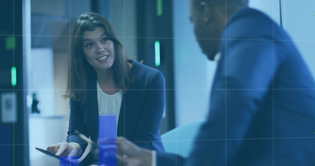 Diverse Professionals Analyzing Financial Data in Modern Office