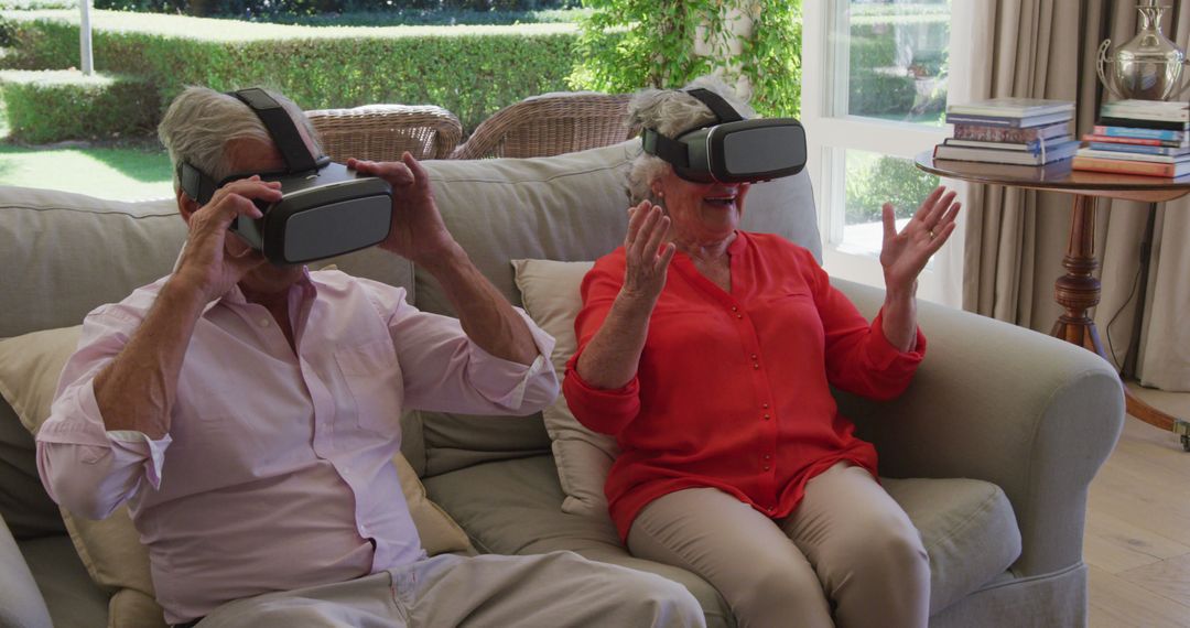 Senior Couple Excitedly Using Virtual Reality Headsets - Free Images, Stock Photos and Pictures on Pikwizard.com