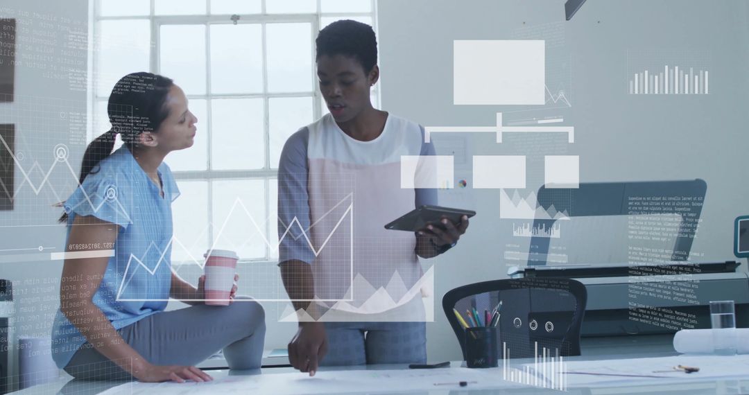 Diverse Colleagues Discussing Financial Data with Technology Graphics