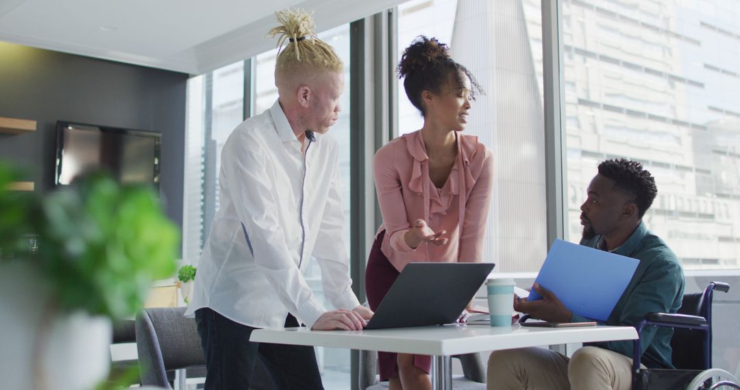 Collaborative Teamwork in Diverse Creative Office with Engaged Discussion