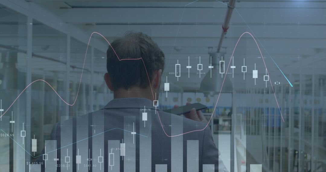 Businessman Analyzing Stock Market Trends with Financial Graphs - Free Images, Stock Photos and Pictures on Pikwizard.com