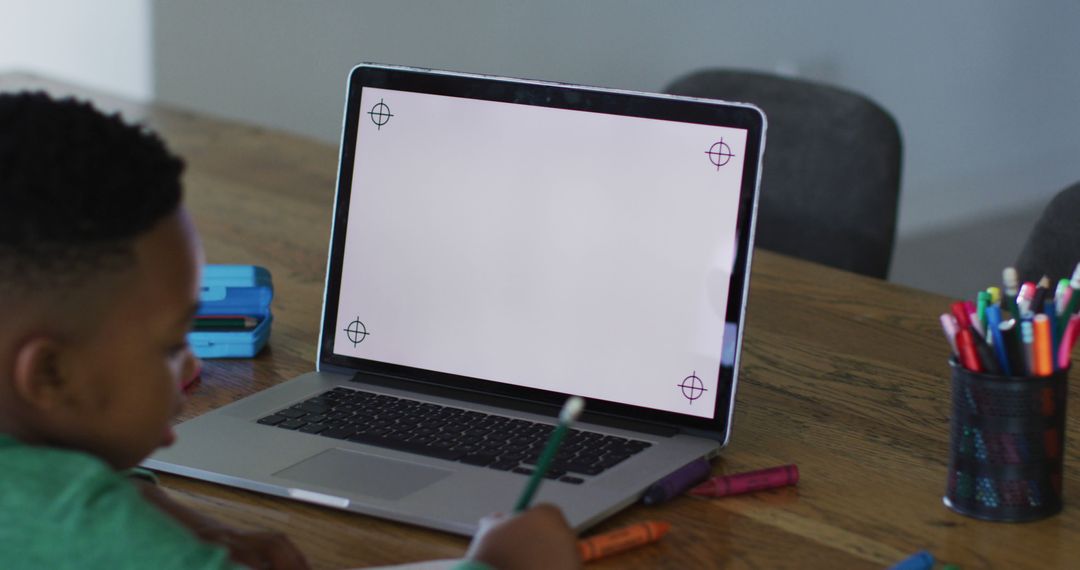 Boy Studying at Home with Laptop for Online Learning