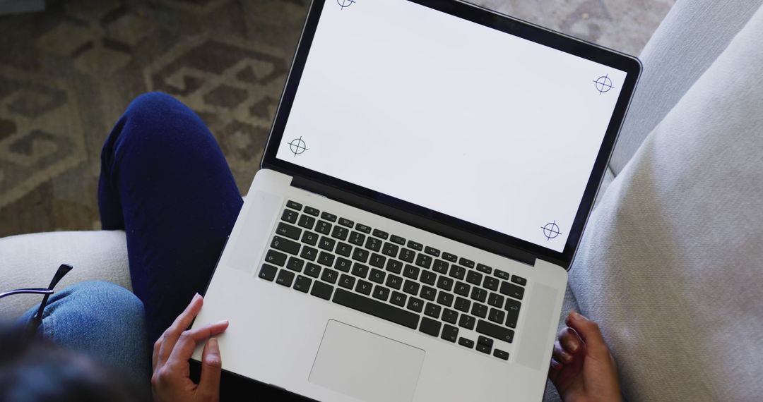 Close-Up of Person Using Laptop with Blank Screen at Home - Free Images, Stock Photos and Pictures on Pikwizard.com