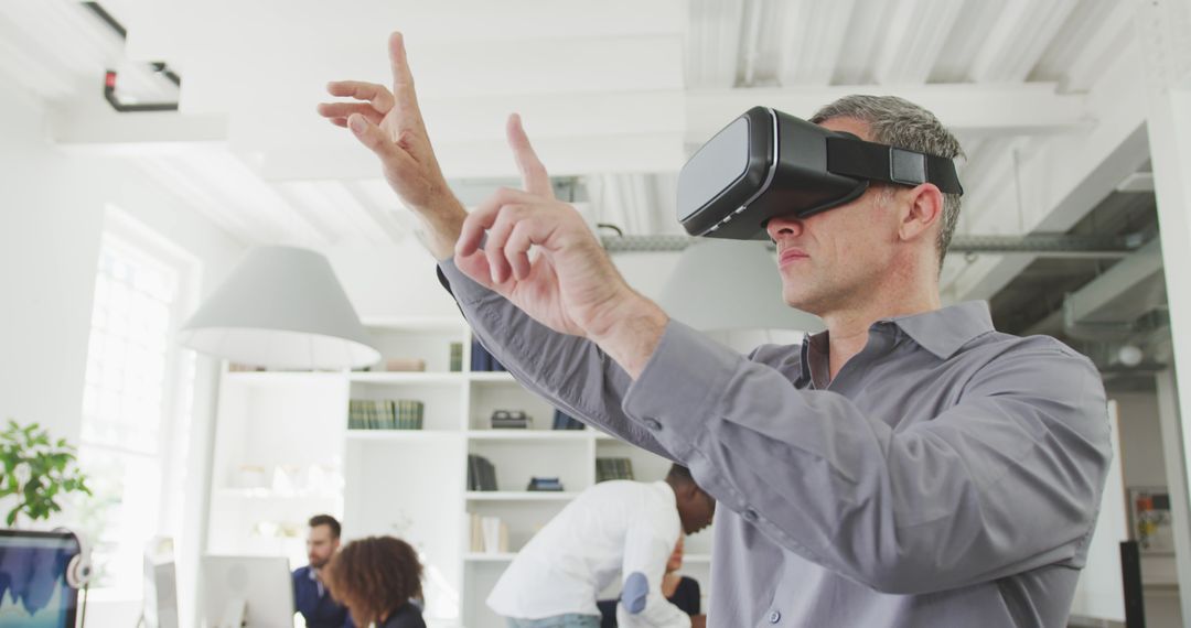 Senior Businessman Using Virtual Reality Glasses in Office - Free Images, Stock Photos and Pictures on Pikwizard.com