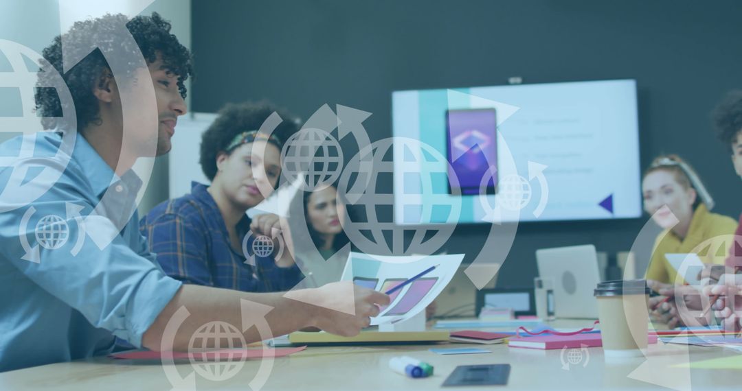 Diverse Team Collaborating in Modern Office with Technology Symbols Overlay