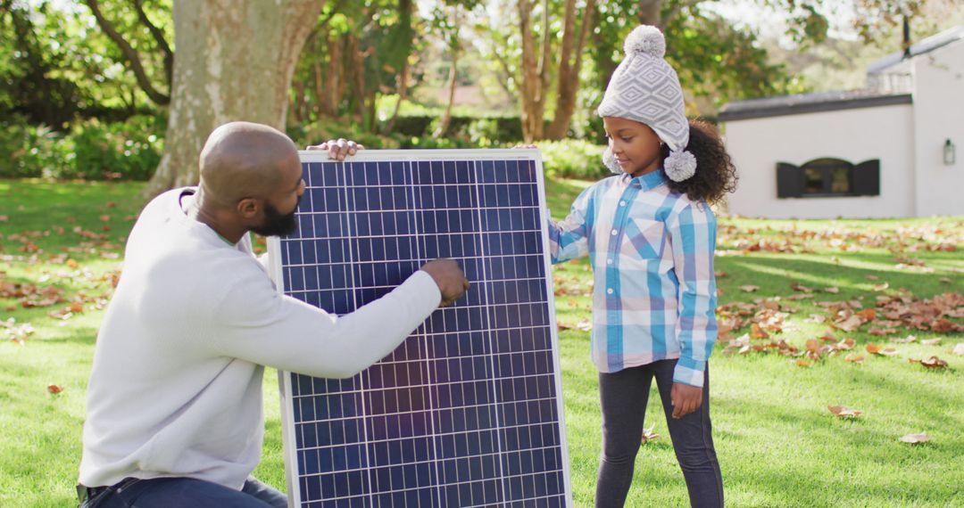 Father and Daughter Learning About Solar Panel Installation - Free Images, Stock Photos and Pictures on Pikwizard.com