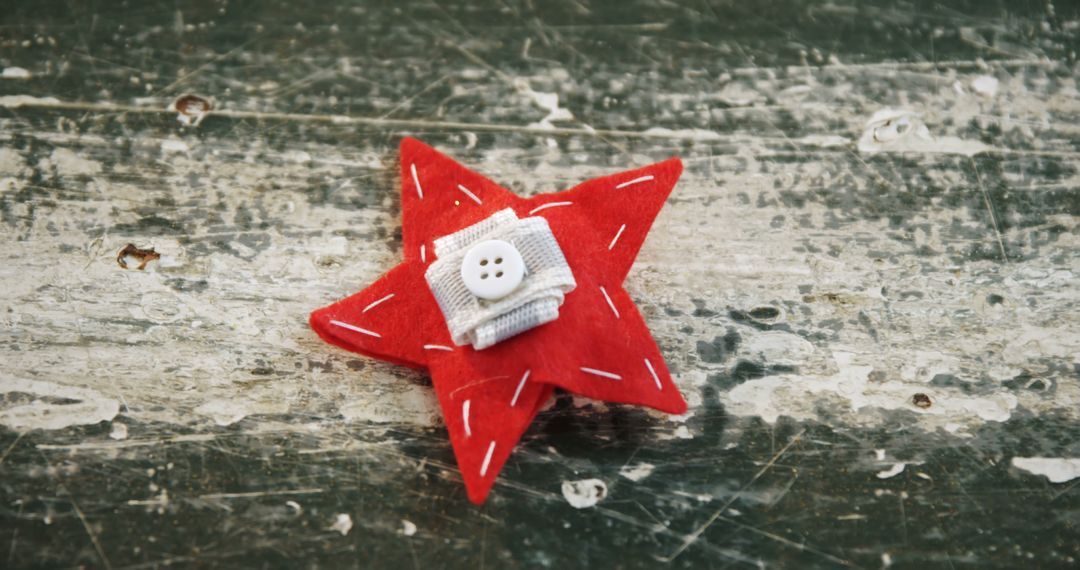 Handcrafted Red Felt Star with Buttons on Rustic Surface - Free Images, Stock Photos and Pictures on Pikwizard.com