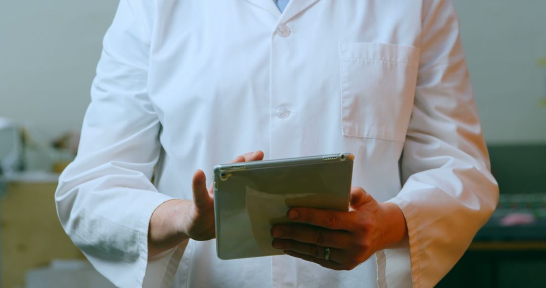 Medical Professional Using Digital Tablet in Lab Coat - Free Images, Stock Photos and Pictures on Pikwizard.com