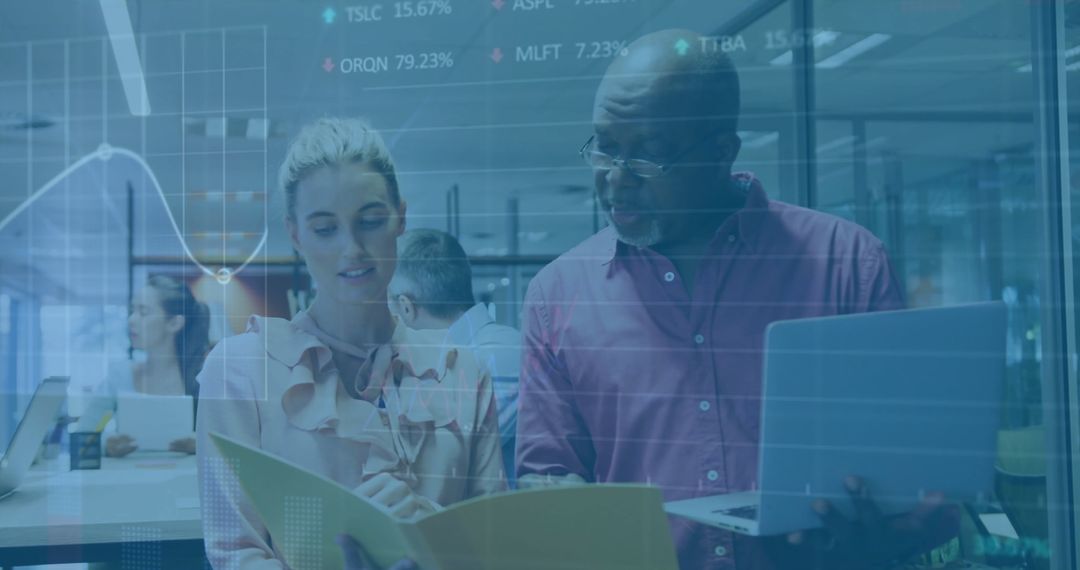 Racially Diverse Business Colleagues Analyzing Financial Data in Modern Office