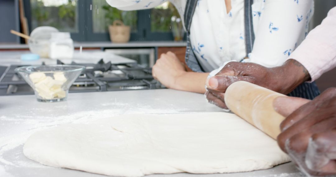 Couple Rolling Dough Together in Modern Kitchen - Free Images, Stock Photos and Pictures on Pikwizard.com