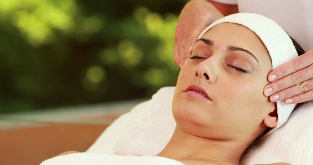 Woman Relaxing During Spa Treatment with Facial Massage - Free Images, Stock Photos and Pictures on Pikwizard.com