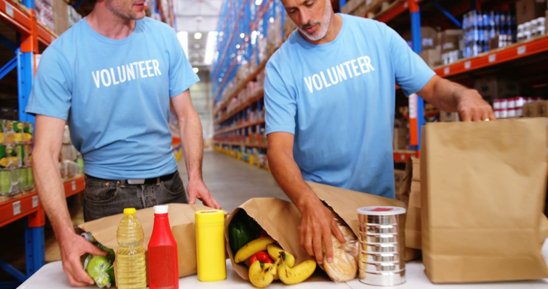 Volunteers Packing Food Supplies in Warehouse - Free Images, Stock Photos and Pictures on Pikwizard.com