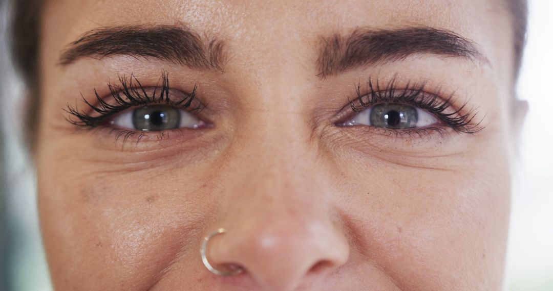 Close-Up of Woman's Eyes and Nose, Gold Nose Ring, Long Eyelashes - Free Images, Stock Photos and Pictures on Pikwizard.com