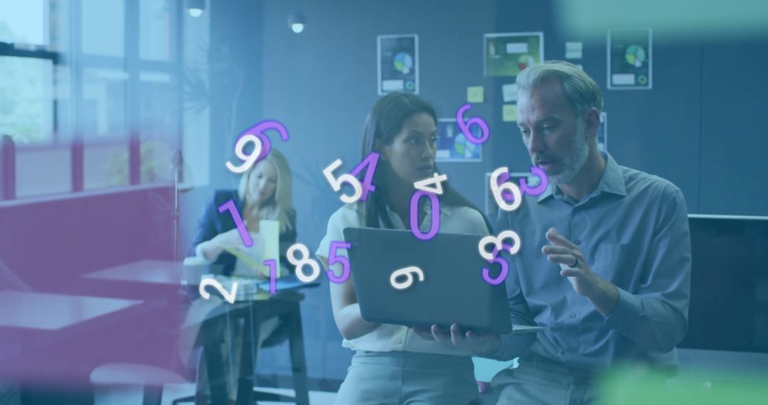 Team Analyzing Data with Digital Interface in Office