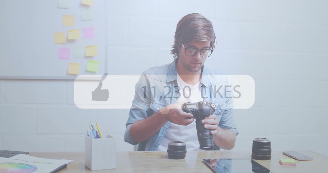 Photographer Inspecting DSLR Camera at Creative Workspace