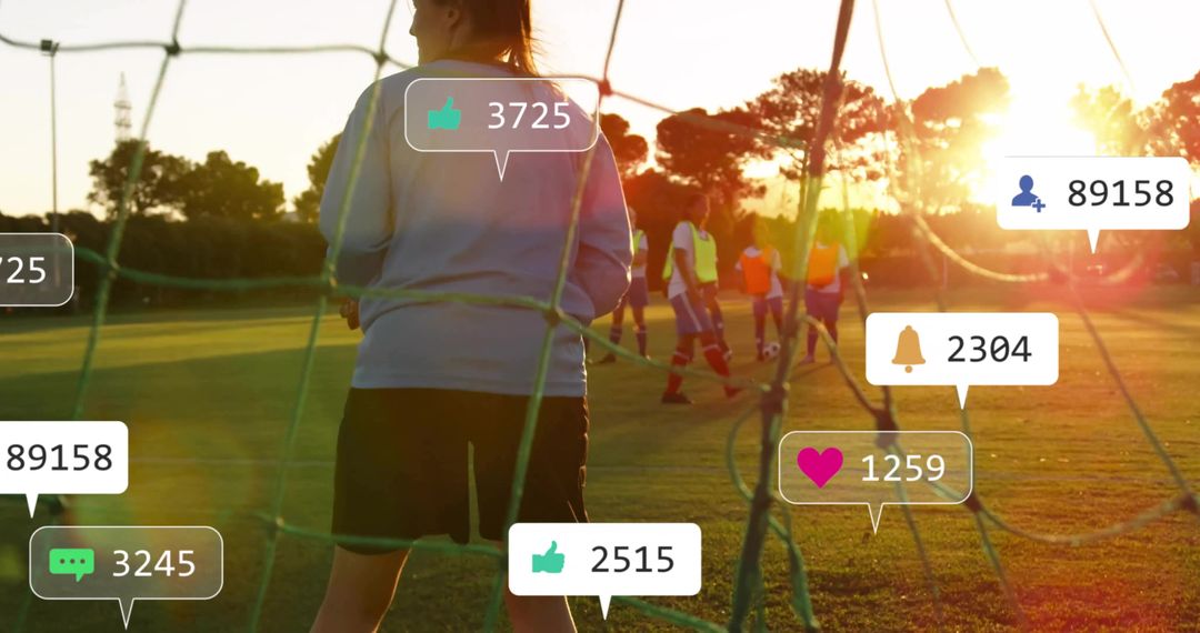 Goalkeeper standing behind net at golden hour during youth soccer training social overlays
