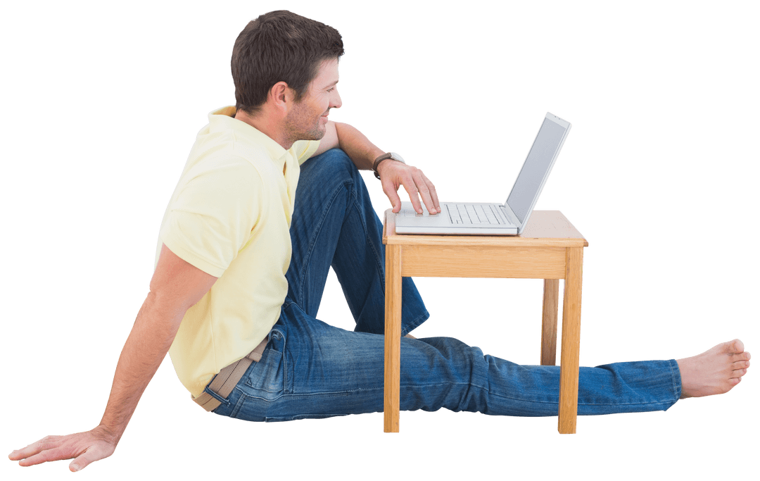 Smiling Man Using Laptop Sitting on floor isolated and Semi-Transparent