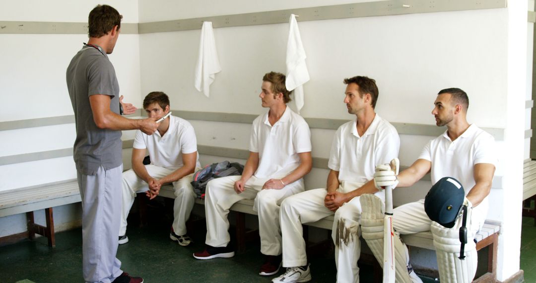 Cricket Team Listening to Coach in Locker Room - Free Images, Stock Photos and Pictures on Pikwizard.com