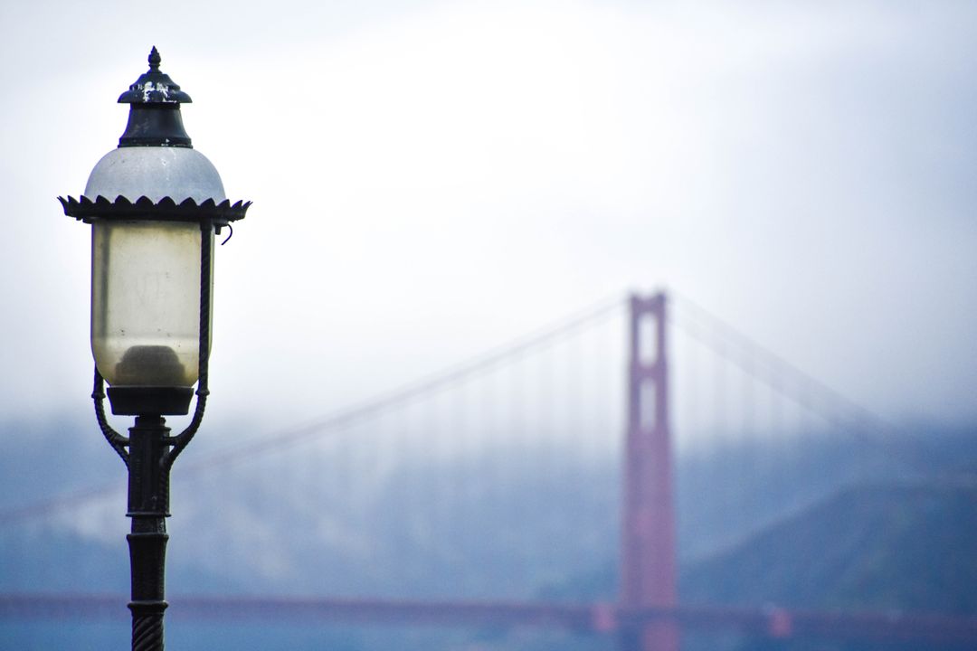 Vintage streetlamp with Golden Gate Bridge in background - Free Images, Stock Photos and Pictures on Pikwizard.com